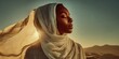 © NovaVision - Serene Black woman with headscarf in desert at sunset, bathed in golden light