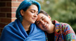 © Inspire Shots Hub - Close-up of two people sharing an intimate moment, one resting head on the other's shoulder, symbolizing connection, friendship, and affection