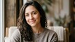 © Indra - Smiling Woman with Dark Wavy Hair in Cozy Sweater, Natural Light Portrait