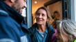 © Kateryna - A paramedic speaks kindly with a family after successful emergency care in a bright modern home doorway successful care emergency response family relief paramedic trust human