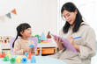 © chokniti - Teacher child girl learning classroom play education happy notebook pen