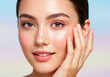 © BG remover aditta - Woman with healthy glowing skin touching her face on colorful background