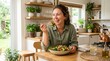 © aalami - Woman Enjoying Healthy Salad Lunch at Bright Home Kitchen