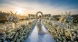 © Raffanza - Elegant outdoor wedding ceremony aisle decorated with white flowers beneath a glowing sunset, creating a romantic and luxurious celebration setting