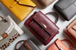 © SilentSmog - Top view of assorted textured leather handbags on display with accessory collection shopping hardware selection merchandise craftsmanship overhead composition material organizer