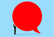 © Westend61 - Businessman looking up at a large red speech bubble symbolizing communication and opinion
