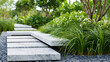 © Nataliya - Stunning minimalist landscape architecture with a serene garden pathway of floating white marble steps over lush greenery, with copy space