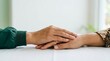 © Flower - Two People Holding Hands on a Table