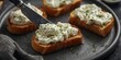 © vxnaghiyev - Fresh herb cream cheese on crispy toasted bread served with a spreading knife, fiber dense delight