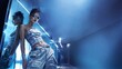 © crispy - Woman leaning against mirror wearing stylish metallic y2k clothing. Futuristic fashion model with sunglasses in blue neon light studio. Retro aesthetic style from the early two thousands