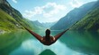 © Black M ♛ - Woman relaxing in a hammock overlooking a mountain lake.