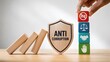 © M@rketVisualsStudio - Anti corruption wooden shield stopping falling dominoes beside a hand stacking colorful blocks with legal compliance icons, representing business ethics and fraud prevention