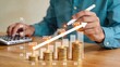 © Olivia - Business financial growth chart with gold coins stacks rising up, investment profit increase concept, money savings accumulation over time, economic success and wealth building
