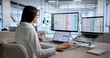 © Andrey Popov - Young Woman Medical Coding Specialist Reviews Billing Data