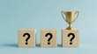 © シャキルスタジオ - Three wooden blocks with question marks and a golden trophy on the last block, symbolizing winning and reward