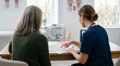 © Joyko12 - A doctor explaining medical results to a patient in an office setting. The doctor is pointing at a document, while the patient listens attentively
