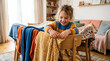 © Angavlan - Child building fort with colorful blankets and enjoying imaginative play at home. Fort includes cozy fabrics draped across chairs, creating a fun space for storytelling and games.