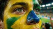 © Joan - Close up of fan with face painted in Brazil colors.