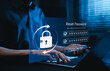 © Supatman - Password Reset and Secure Account Recovery Concept. Person using laptop and smartphone with padlock, password fields, checkmarks, change password button, and cybersecurity verification interface.