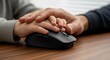 © softwarelab - Child and adult hands on computer mouse.