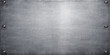 © Al Amin - A dark grunge brushed metal plate texture with rivets on an old vintage gray concrete wall backdrop