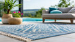 © Nataliya - Close-up of a modern outdoor rug near a pool and sofa with abstract pattern on backyard tiles, poolside decor concept, outdoor rug photography, contemporary patio visualization,