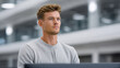 © visoot - Young adult man office modern workspace professional focused technology casual male employee business workplace confident