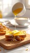 © Lemper - A breakfast scene with toast being drizzled with syrup