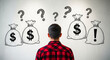 © ANDERSSON OLOF KARL - Man looking at money bag sketches and question marks. Back view of person considering financial options and investments. Money management and uncertainty concept for banking and finance.