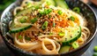 © tutup - A bowl of noodles with cucumber and sesame seeds