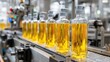 © Adri - Bottled liquid with pumps moves down a manufacturing line