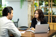 © NVB Stocker - Happy young beautiful woman working and talking with customer at home office. saleswomen and businesswoman concept.