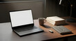 © Microstock - Quiet evening workspace with a laptop, steaming mug, and books on a wooden desk, illuminated by a warm lamp for focused productivity and contemplation