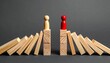 © Muji Creatives - Wooden figurines domino barrier separation conflict concept