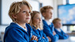© Nataliya - Close-up of young students in uniform watching an interactive screen in a modern classroom setting, interactive screen concept, student and screen photography, modern school