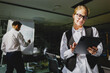 © muse studio - Creative brainstorming session in a modern office during evening hours with a focused team