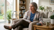 © Xenia - Older woman using a voice-controlled smart speaker in her living room. Senior female speaking to a smart home device for ambient assisted living and emergency response