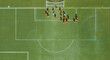 © 晨啸 周 - Aerial view of children in orange jerseys running across the soccer field during soccer practice at a sports park in Wuhan, China.
