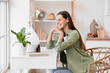 © Pixel-Shot - Young woman with air humidifier and essential oils on table at home