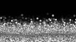 © vuang - Shimmering silver bokeh background with sparkling glitter effect.