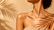 © skincare - Closeup of a womans glowing tanned skin with palm leaf shadow, summer beauty and skincare concept