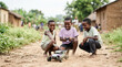 © OlgaNeuroArt - African children playing with a remote control car on a dirt road. Group of boys laughing and enjoying a toy vehicle in a rural village. Childhood joy and technology
