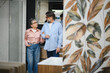 © Serhii - Senior couple choosing bathroom tiles in home decor showroom