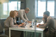 © ty - Creative business people, planning and meeting and brainstorming, ideas or strategy at office, view from glass wall.
