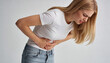 © Ekaterina - Woman suffering from stomach pain and touching belly. Girl feeling abdominal ache or cramp. Premenstrual syndrome, gynecological health issue and digestive system discomfort concept.