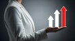 © SHARMIN - Woman in white blazer holds three upward pointing arrows symbolizing growth business