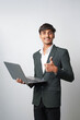 © Niks Ads - happy young indian professional man holding laptop standing on white background