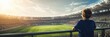 © crispy - Child standing at stadium railing looking at soccer field match. Young boy fan watching game in arena. Banner with copy space