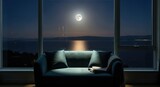 Night view of full moon over sea from window.