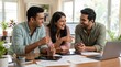 © N7 - Creative Agency and Collaboration Concept: Group of Indian Designers Working Together at Desk in Modern Bright Studio
